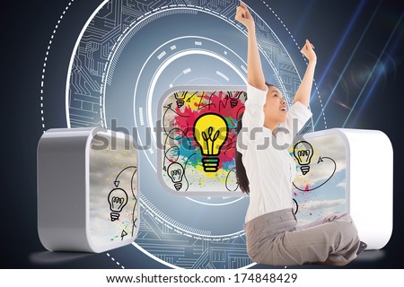 Businesswoman sitting cross legged cheering against black background with glowing circle