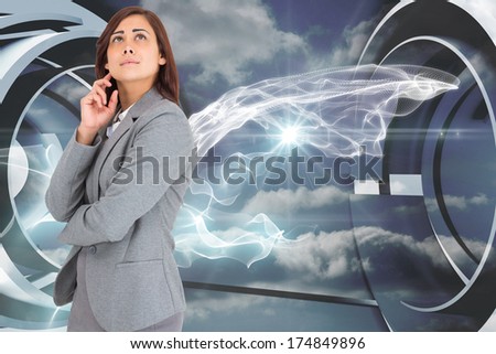 Worried businesswoman against cloud and energy design on a futuristic structure