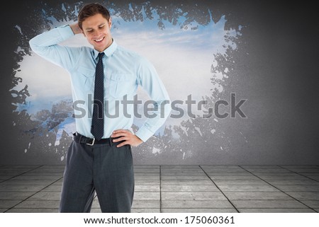 Thinking businessman with hand on head against splash on wall revealing snowy peak