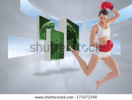 Motivated fit brown haired model in sportswear jumping against bright white room with windows