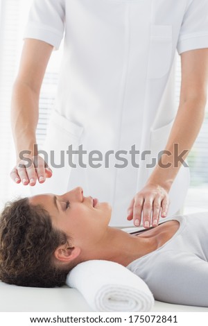 Young Woman Receiving Alternative Therapy At Health Spa
