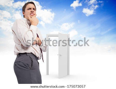 Thoughtful businessman with hand on chin against opening door in sky