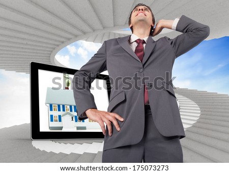Thinking businessman scratching head against spiral staircase in the sky