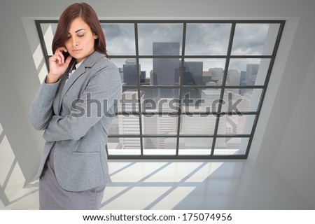 Thoughtful businesswoman against cityscape seen through window