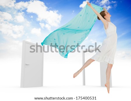 Young beautiful female dancer with blue scarf against closed and open doors in sky
