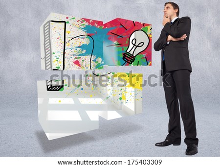 Thinking businessman touching chin against grey wall