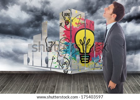 Cheerful handsome businessman standing against sky painted on wall