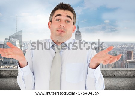Clueless office worker posing against balcony overlooking city