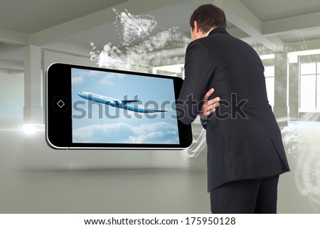 Thinking businessman against abstract white design in room