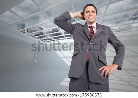 Thinking businessman scratching head against cityscape seen through window