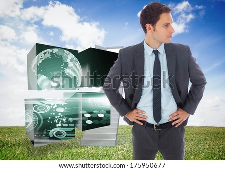 Serious businessman standing with hands on hips against open door at top of stairs in a field