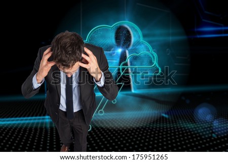 Stressed businessman with hands on head against keyhole on technological background