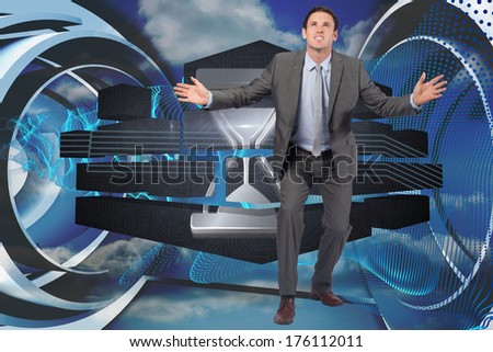 Businessman standing with arms out against abstract blue design in futuristic structure