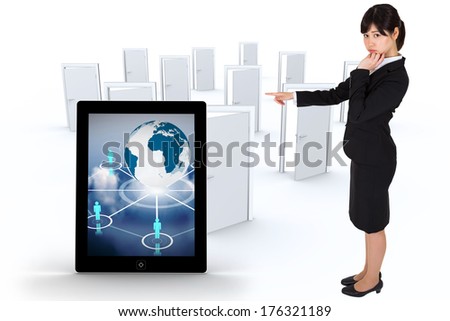 Businesswoman pointing against many doors opening