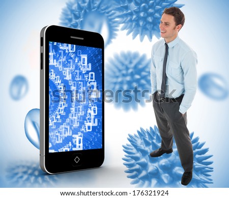 Happy businessman standing with hands in pockets against blue virus cells