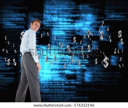 Happy businessman standing with hands in pockets against blue blurred texts