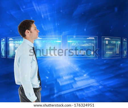Serious businessman standing with hand in pocket against abstract blue squares