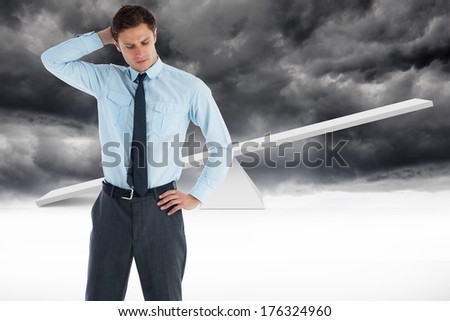 Thinking businessman with hand on head against white scales in front of storm clouds