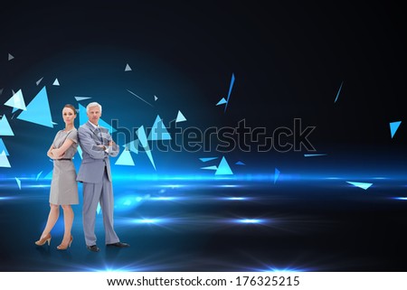 Serious businessman standing back to back with a woman against small pyramids on technical background