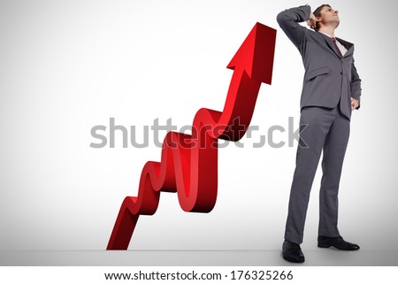 Thinking businessman scratching head against red arrow pointing up