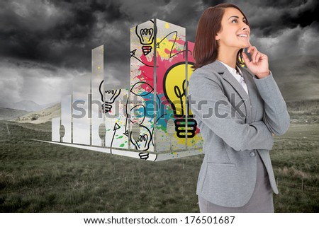 Happy businesswoman against stormy countryside background