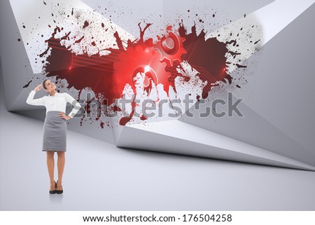 Smiling thoughtful businesswoman against splash on wall revealing red cogs and wheels