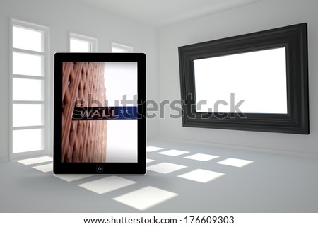 Wall street on tablet screen against digitally generated room with picture frame