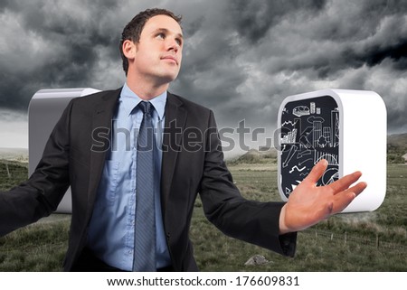 Businessman posing with arms out against stormy countryside background