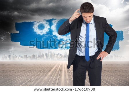 Thinking businessman scratching head against screen showing cogs and wheels