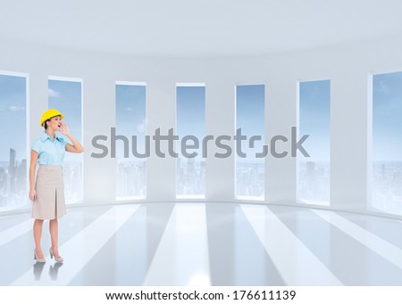 Attractive architect yelling against bright white room with windows