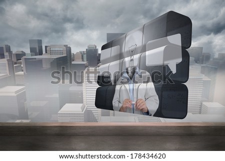 Light bulb man on abstract screen against cityscape in the fog