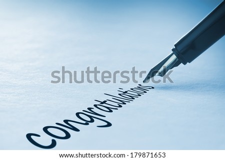 Fountain pen writing the word congratulations