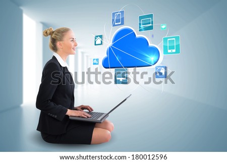 Digital composite of blonde businesswoman sitting using laptop with cloud and app icons