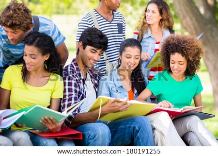 Young university students studying together on college campus