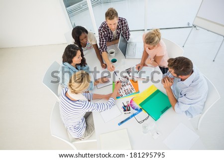 Young design team brainstorming together in creative office