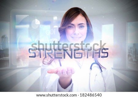 The word strengths and portrait of female nurse holding out open palm against global business hologram