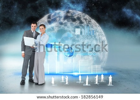 Digital composite of happy business team using laptop with interface and human representations, elements of this image furnished by NASA