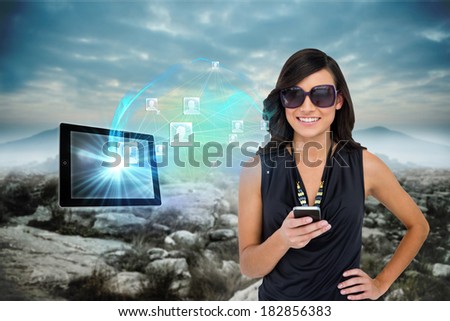Digital composite of glamorous brunette using smartphone with profile pictures