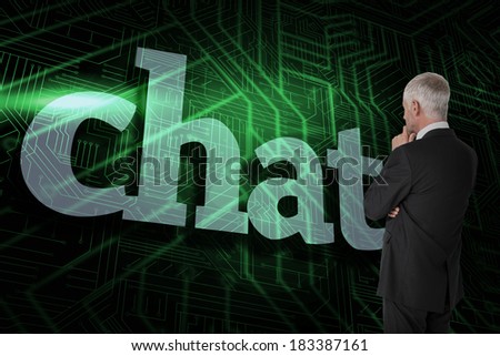 The word chat and thoughtful businessman standing back to camera against green and black circuit board