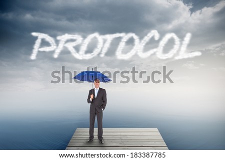 The word protocol and businessman smiling at camera and holding blue umbrella against cloudy sky over ocean