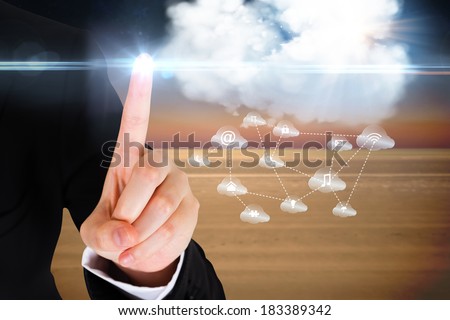 Digital composite of finger pointing to cloud graphic with app icons