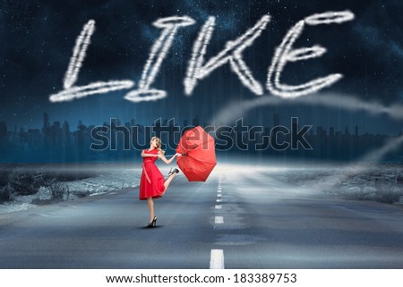 The word like and beautiful woman posing with a broken umbrella against road leading out to the horizon