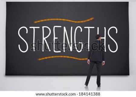 Businessman reading the word strengths