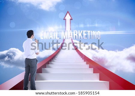The word email marketing and businessman holding glasses against red steps arrow pointing up against sky