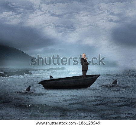 Composite image of happy businessman looking away in a sailboat being circled by sharks