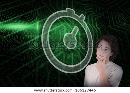 Composite image of stopwatch and casual thinking man against green and black circuit board