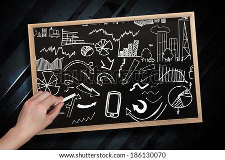 Composite image of hand drawing brainstorm with chalk on chalkboard with wooden frame