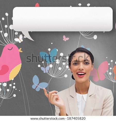 Smiling businesswoman holding a pen with speech bubble against pink bird with heart and dandelions
