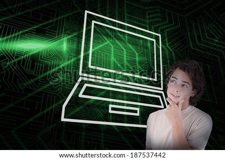 Composite image of laptop and thinking casual man against green and black circuit board