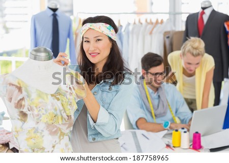 Group of fashion designers at work in a studio